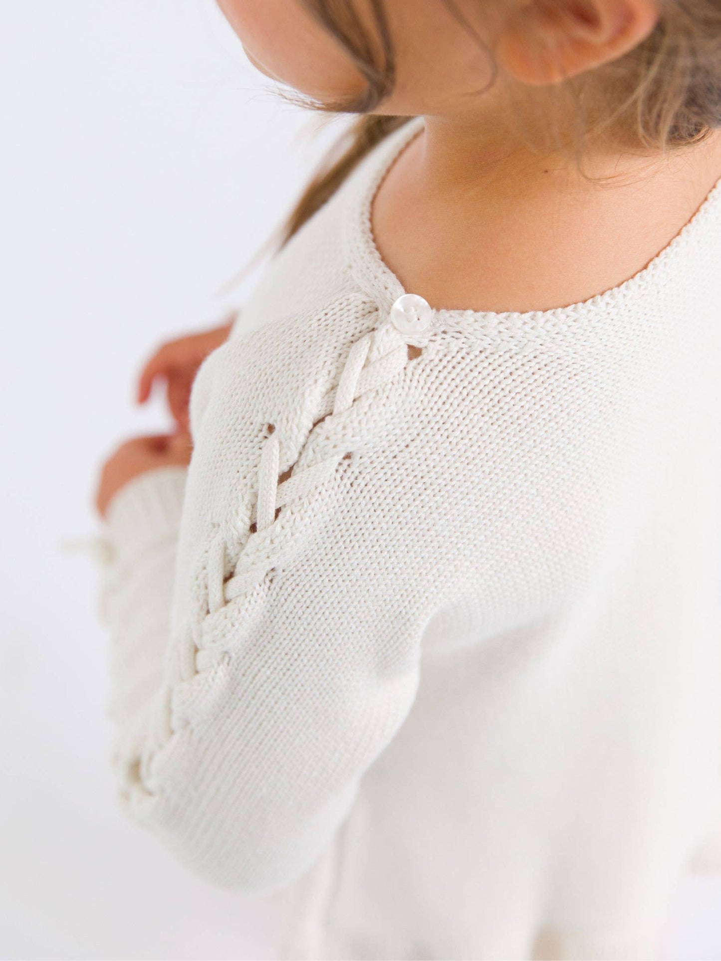 Girls Ivory Ruffle Hem Lace Up Sweater